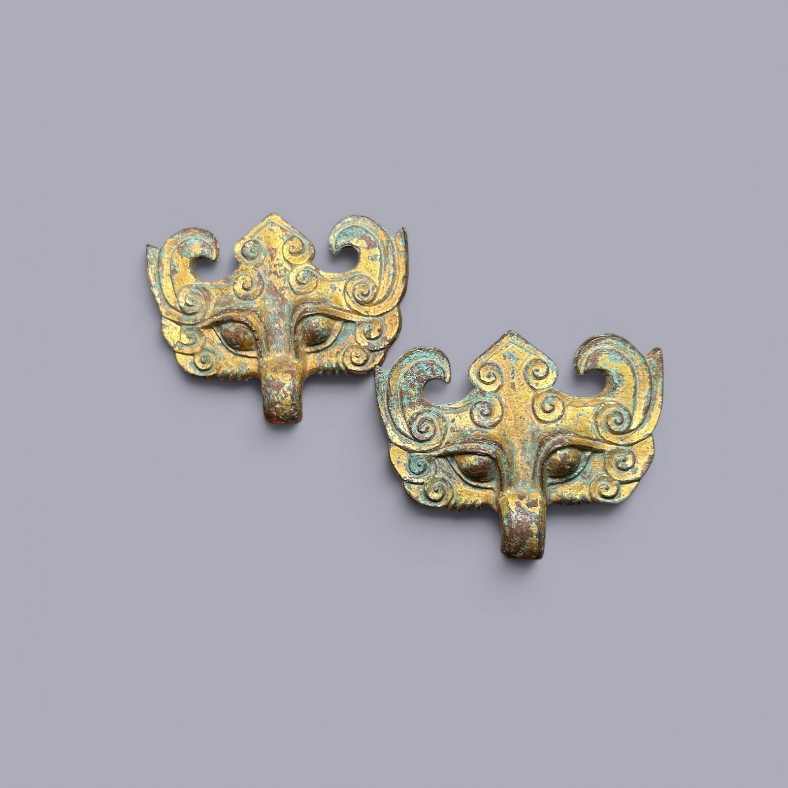 Chinese Art, A Gilt-Bronze Taotie Mask, Spring and Autumn to Warring States Period, 8th-3rd: Chinese Art, A Gilt-Bronze Taotie Mask, Spring and Autumn to Warring States Period, 8th-3rd Century BC, Length 6.2 cm, Width 7.5 cm.