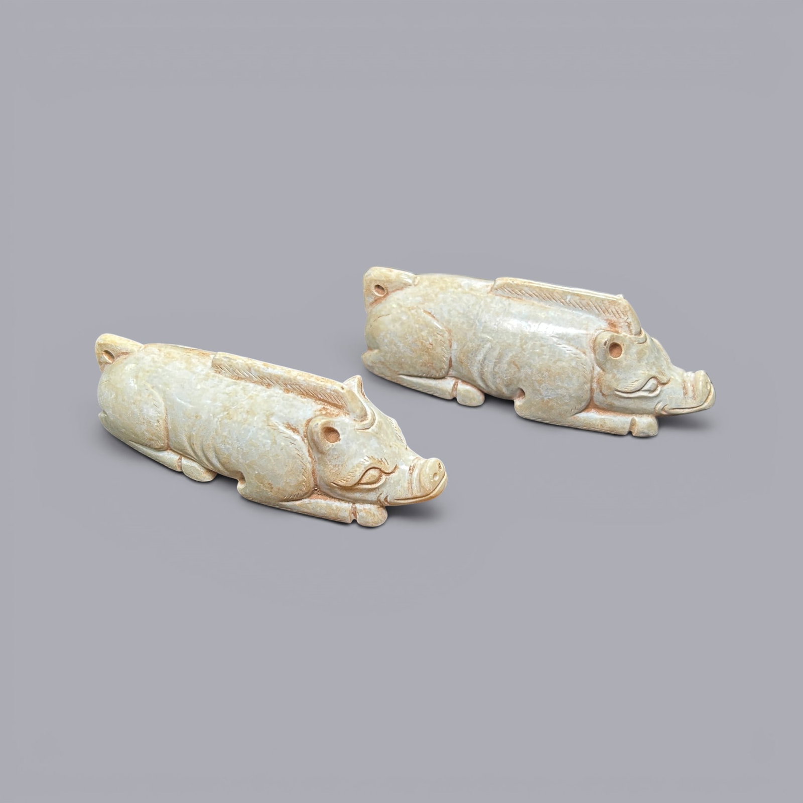 Chinese Art, A Pair of Jade Pigs, 3rd Century BC-3rd Century AD, Han Dynasty: Chinese Art, A Pair of Jade Pigs, 3rd Century BC?C3rd Century AD, Han Dynasty, Length 8.3 cm, Height 3.3 cm, Width 2.6 cm.