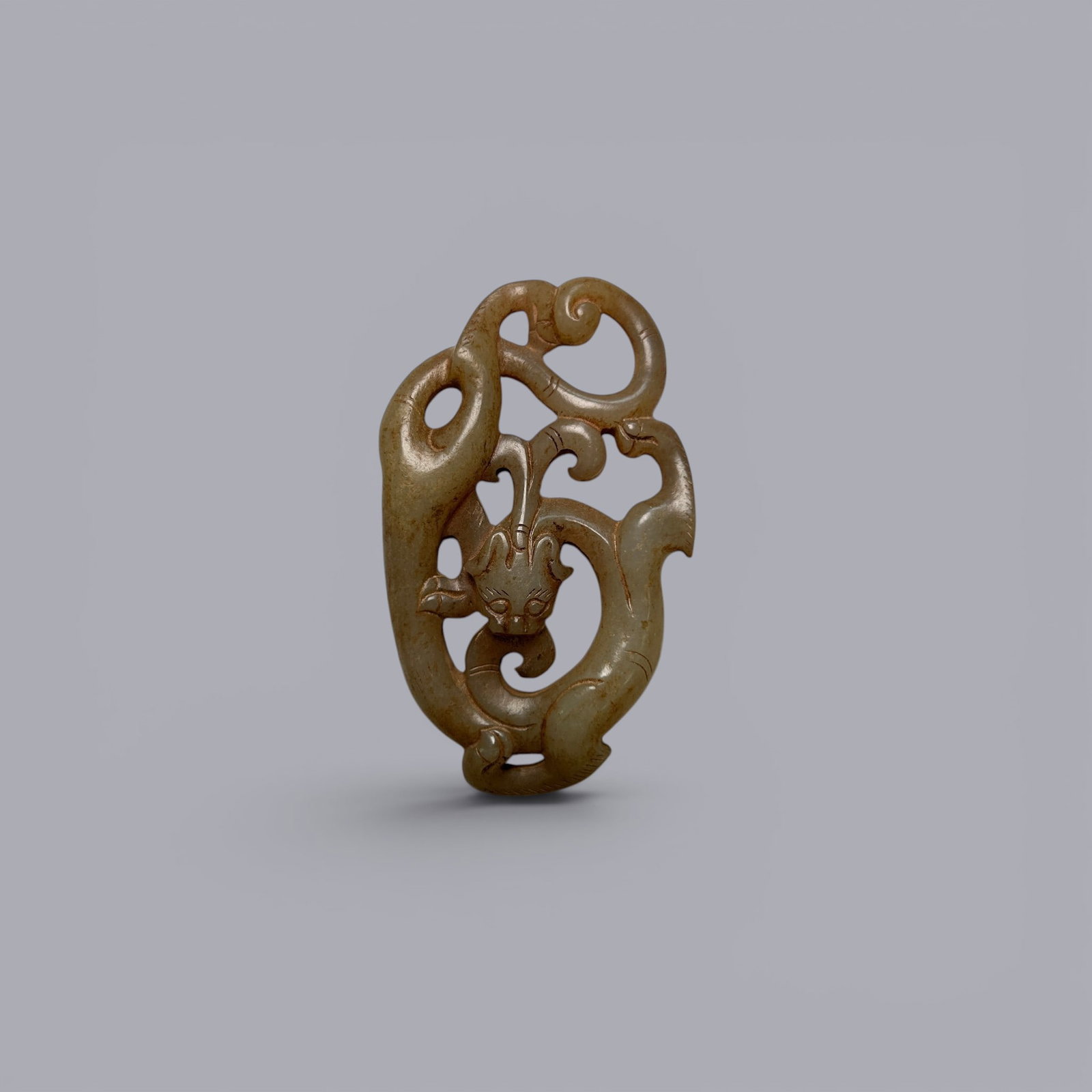 Chinese Art, A Jade Dragon-Shaped Thumb Ring Pendant, 3rd Century BC-3rd Century AD, Han Dynasty: Chinese Art, A Jade Dragon-Shaped Thumb Ring Pendant, 3rd Century BC-3rd Century AD, Han Dynasty, Length 6.7 cm, Width 4.1 cm.