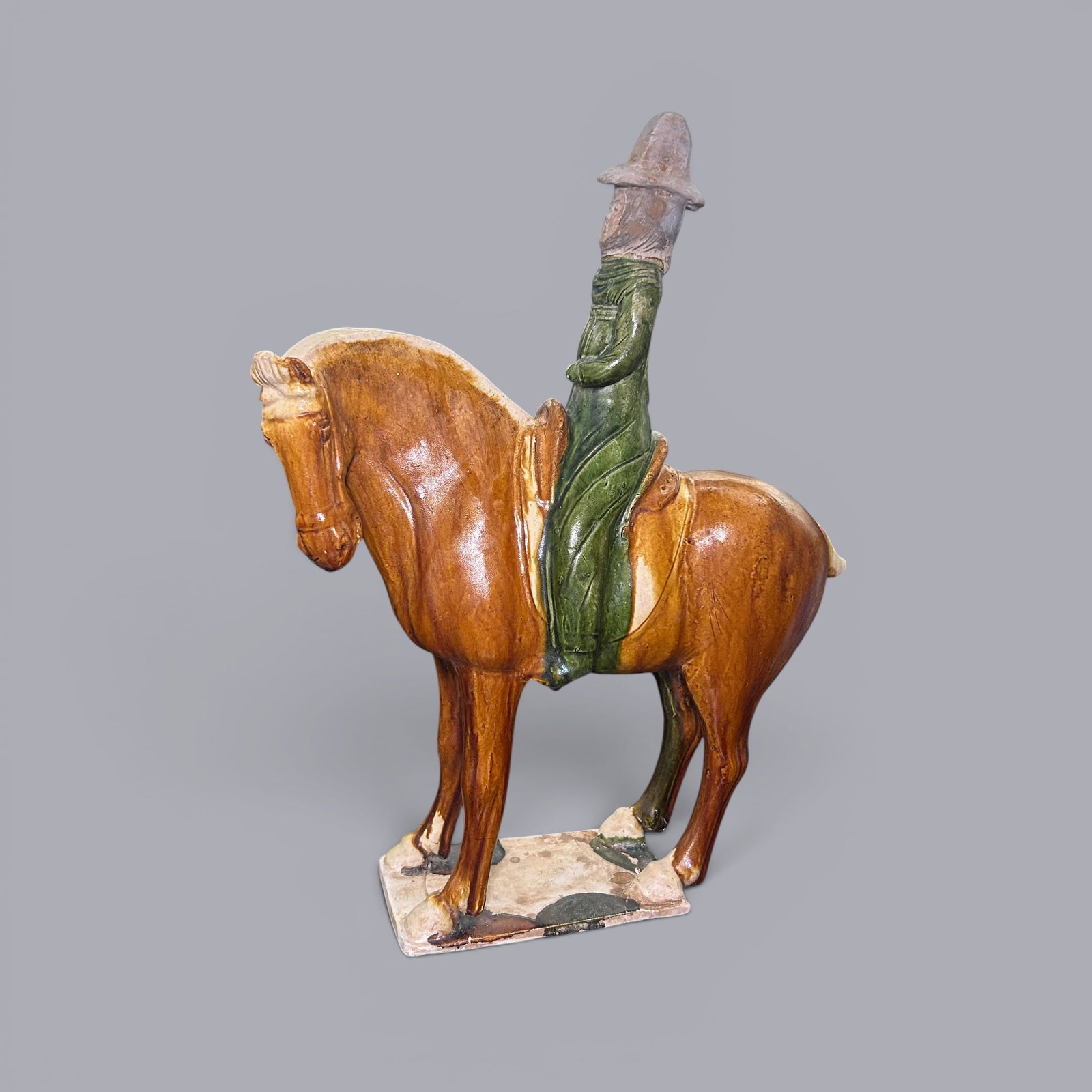 Chinese Art, A Sancai Pottery Figure, Tang Dynasty, 7th-10th Century: Chinese Art, A Sancai Pottery Figure, Tang Dynasty, 7th-10th Century, Height 40 cm, Width 31 cm.