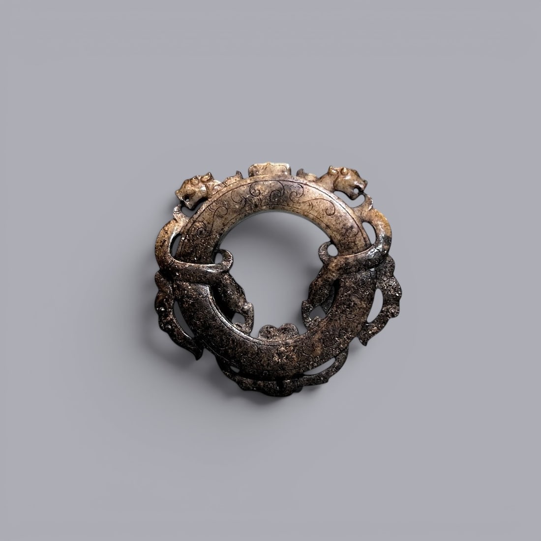 Chinese Art, A Jade Ring Carved with Dragon Motifs, 3rd Century BC-3rd Century AD, Han Dynasty: Chinese Art, A Jade Ring Carved with Dragon Motifs, 3rd Century BC?C3rd Century AD, Han Dynasty, Length 7.1 cm.