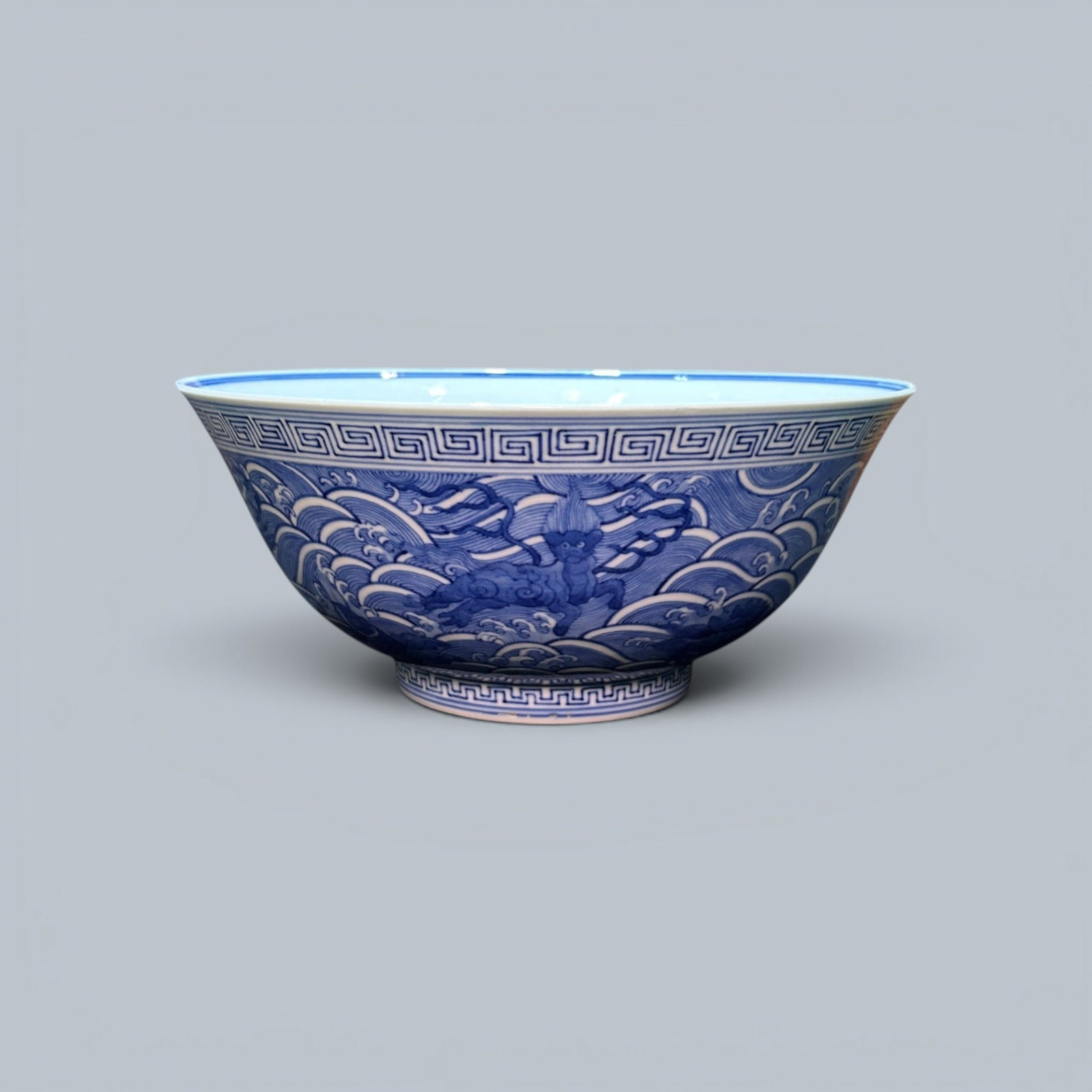 Chinese Art, A Blue and White Bowl Decorated with Waves and Animals, 18th-19th Century, Qing: Chinese Art, A Blue and White Bowl Decorated with Waves and Animals, 18th-19th Century, Qing Dynasty, Height 9.5 cm, Diameter 21.7 cm.