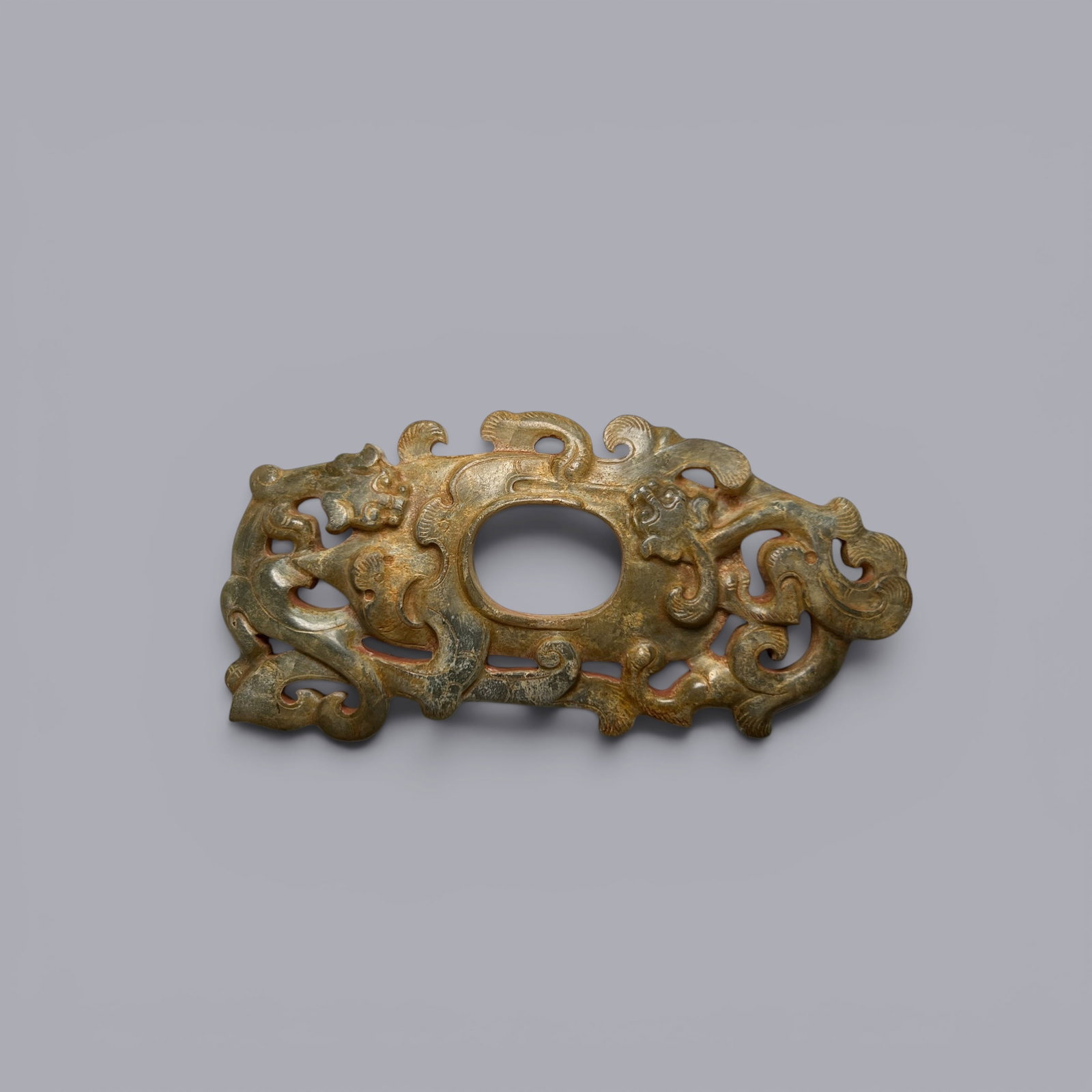 Chinese Art, A Jade Bi-Shaped Pendant Decorated with Dragon Motifs, 3rd Century BC-3rd Century AD,: Chinese Art, A Jade Bi-Shaped Pendant Decorated with Dragon Motifs, 3rd Century BC-3rd Century AD, Han Dynasty, Length 9.7 cm, Width 4.8 cm.