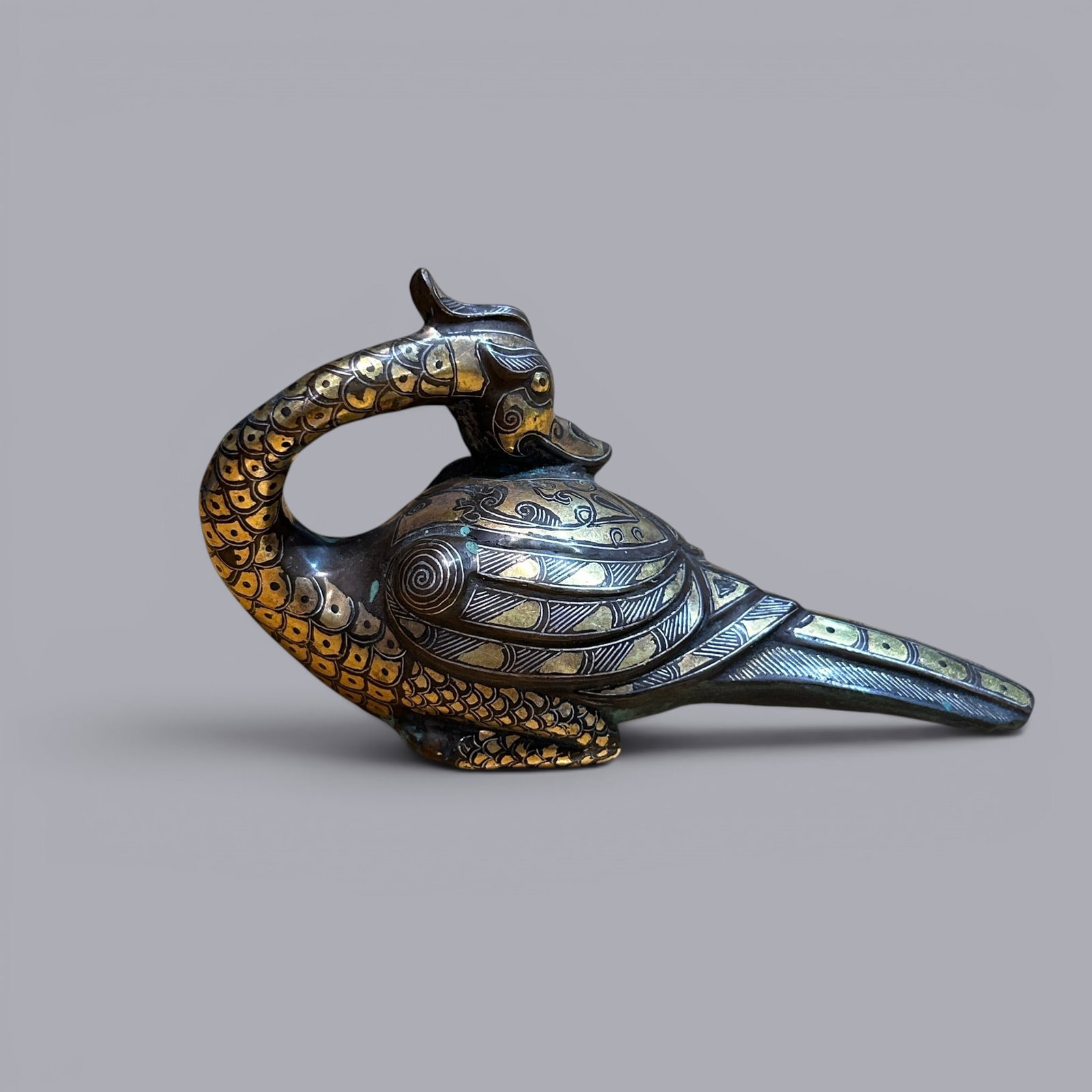 Chinese Art, A Gilt-Bronze Bird, 3rd Century BC-3rd Century AD, Han Dynasty: Chinese Art, A Gilt-Bronze Bird, 3rd Century BC-3rd Century AD, Han Dynasty, Height 7.3 cm, Length 13.6 cm.