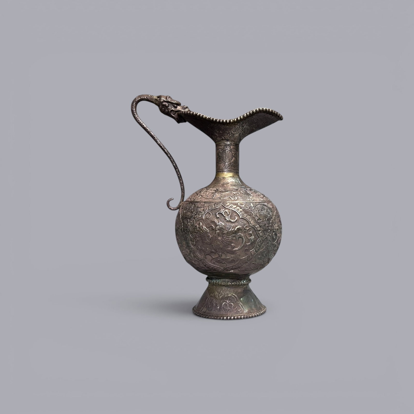 Chinese Art, A Metal Ewer Decorated with Phoenix Motifs, 7th-10th Century, Tang Dynasty: Chinese Art, A Metal Ewer Decorated with Phoenix Motifs, 7th-10th Century, Tang Dynasty, Height 22 cm.