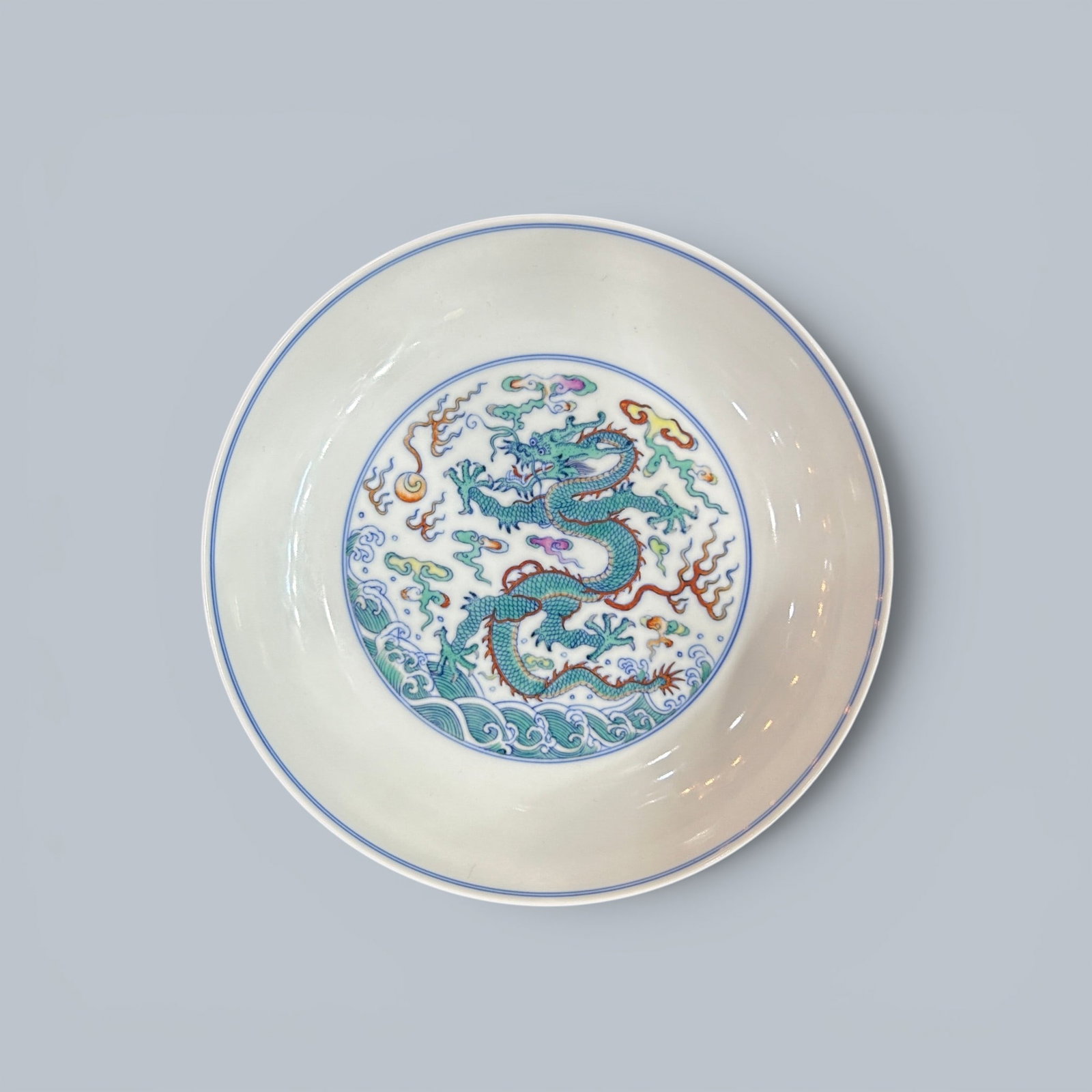 Chinese Art, A Doucai Dish Decorated with Dragons, 18th Century, Qing Dynasty: Chinese Art, A Doucai Dish Decorated with Dragons, 18th Century, Qing Dynasty, Height 4 cm, Diameter 19.6 cm.