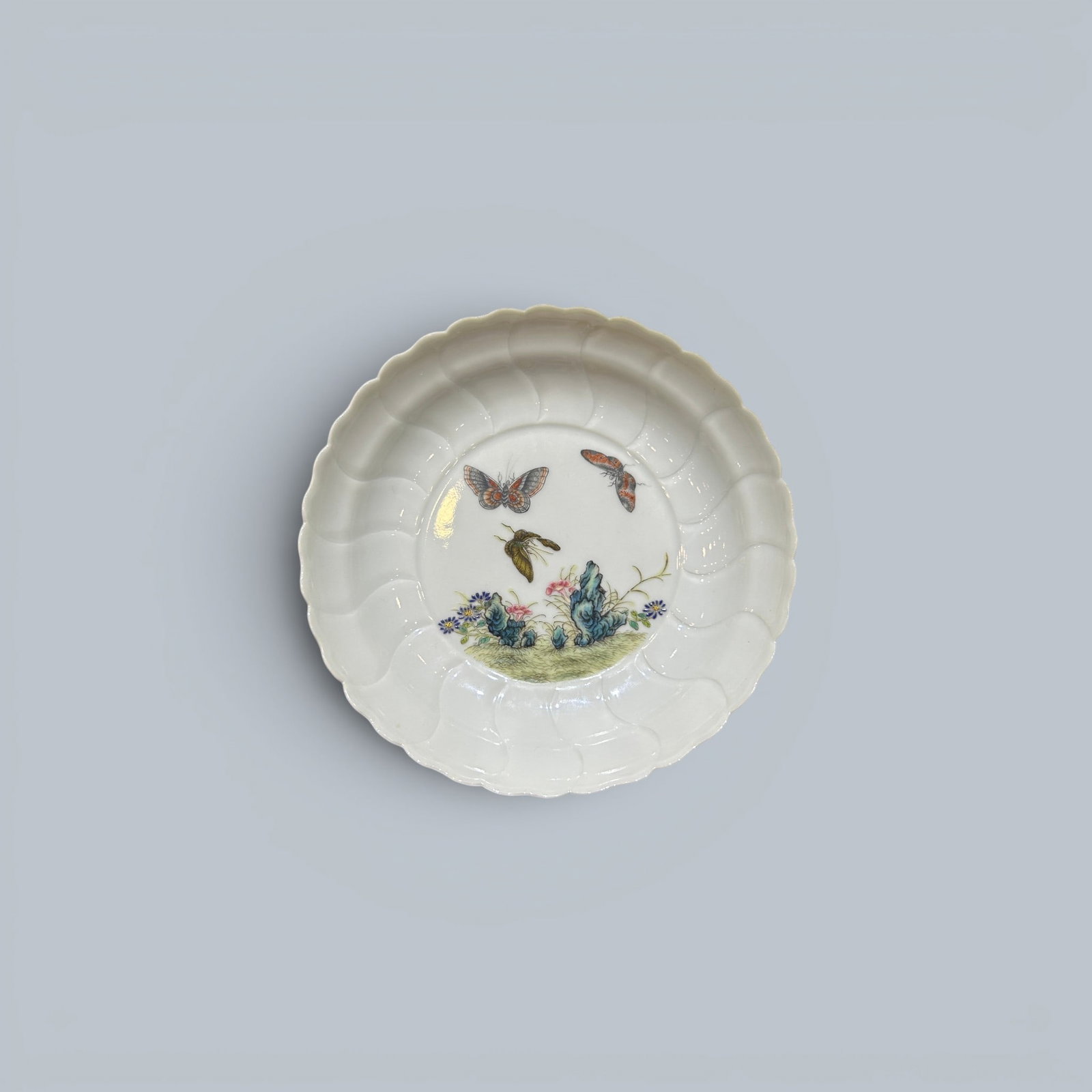 Chinese Art, A Famille Rose Dish Decorated with Flowers and Butterflies, 18th Century, Qing Dynasty: Chinese Art, A Famille Rose Dish Decorated with Flowers and Butterflies, 18th Century, Qing Dynasty, Height 3.2 cm, Diameter 13 cm.