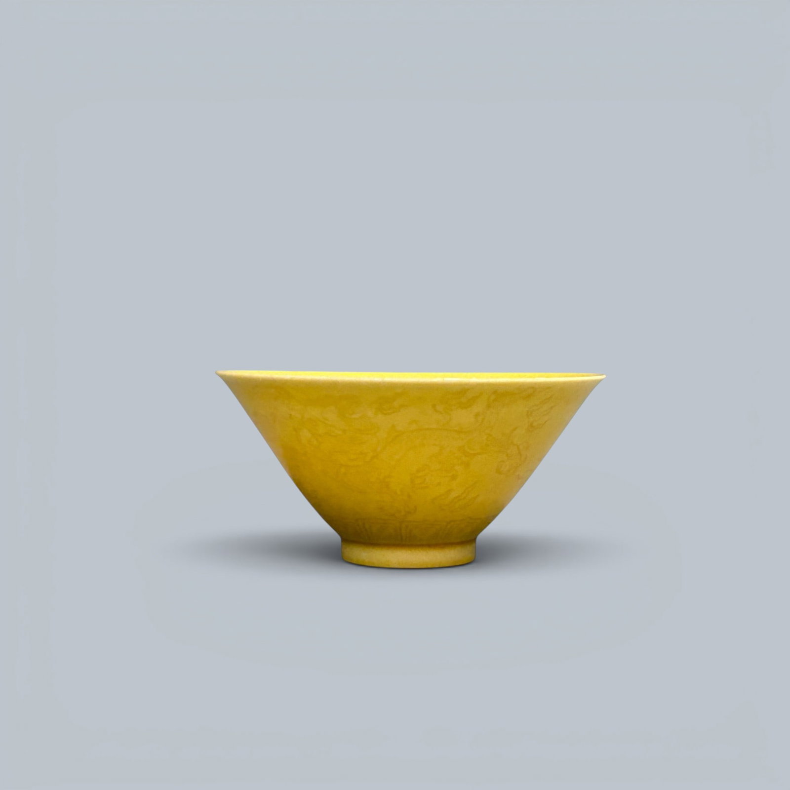 Chinese Art, A Yellow-Glazed Bowl Carved with Dragons, 17th Century, Qing Dynasty: Chinese Art, A Yellow-Glazed Bowl Carved with Dragons, 17th Century, Qing Dynasty, Height 4 cm, Diameter 8.3 cm.