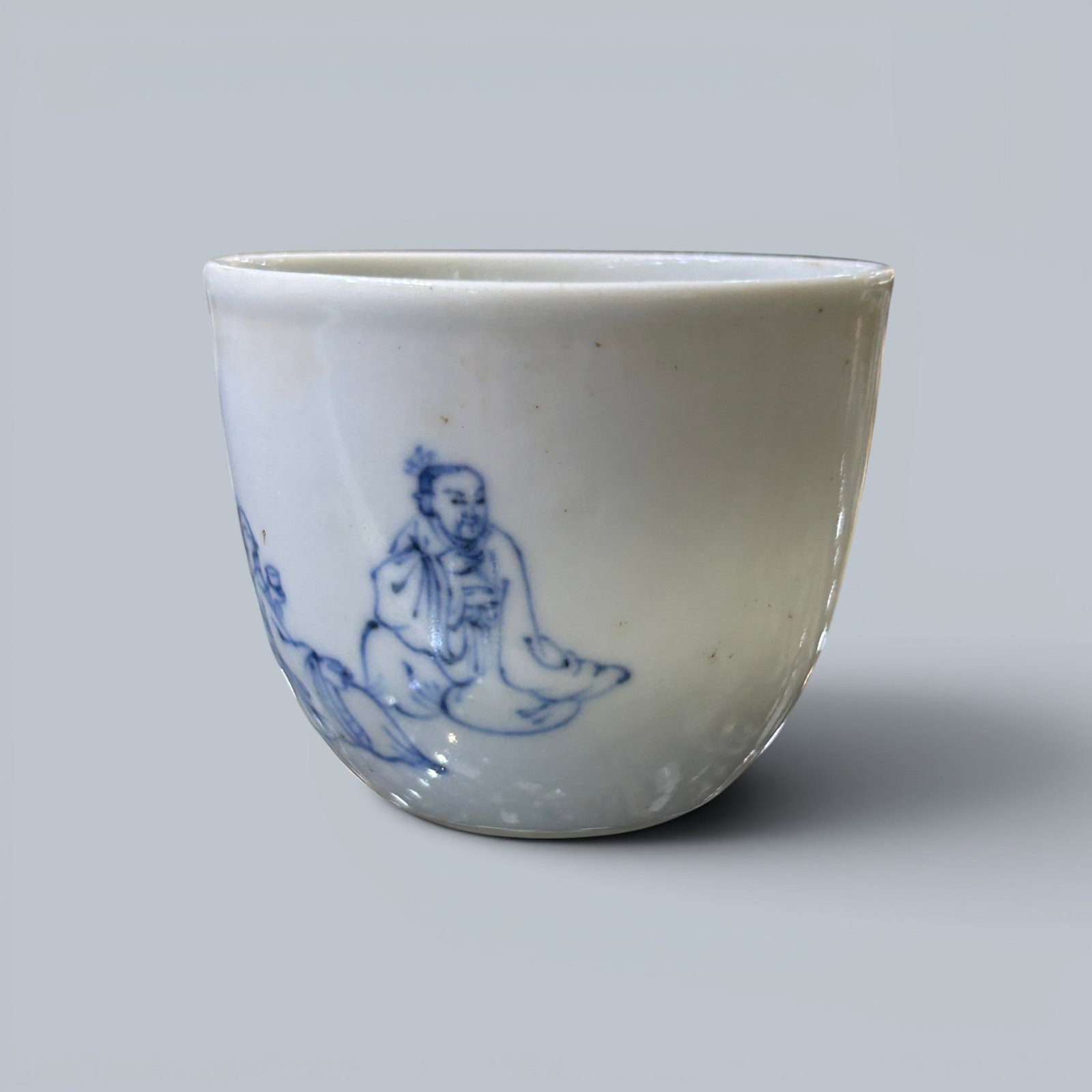 Chinese Art, A Blue and White Cup Decorated with Figures, 17th Century, Qing Dynasty: Chinese Art, A Blue and White Cup Decorated with Figures, 17th Century, Qing Dynasty, Height 5 cm, Diameter 6.1 cm.