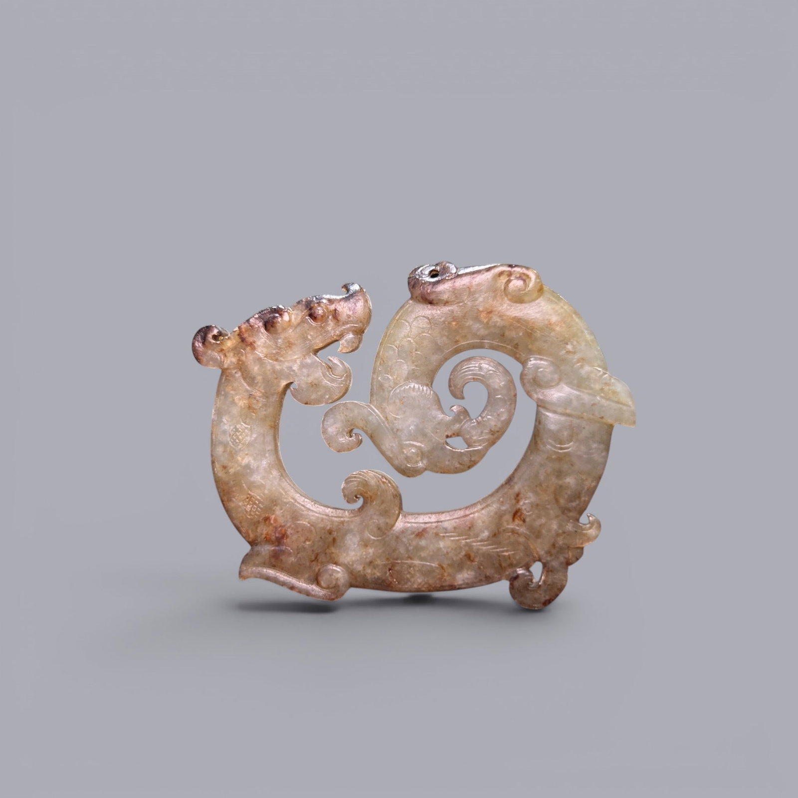 A Jade Dragon, 5th–3rd Century BC, Warring States Period: A Jade Dragon, 5th–3rd Century BC, Warring States Period, Height 4.8 cm, Width 5.6 cm.