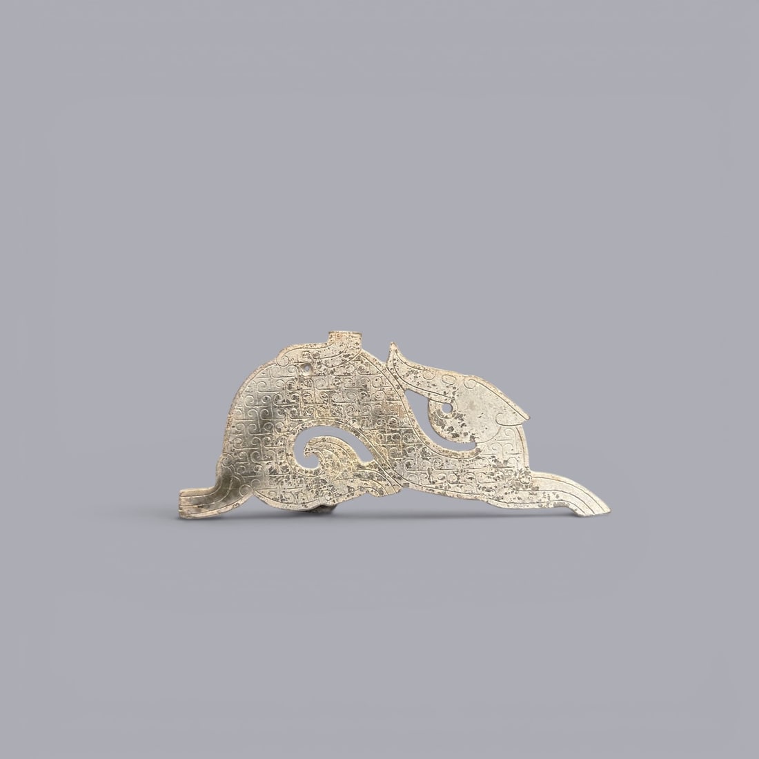 A Jade Ornament, Zhou Dynasty, 8th–3rd Century BC: A Jade Ornament, Zhou Dynasty, 8th–3rd Century BC, Height 2.7 cm, Width 1.2 cm.