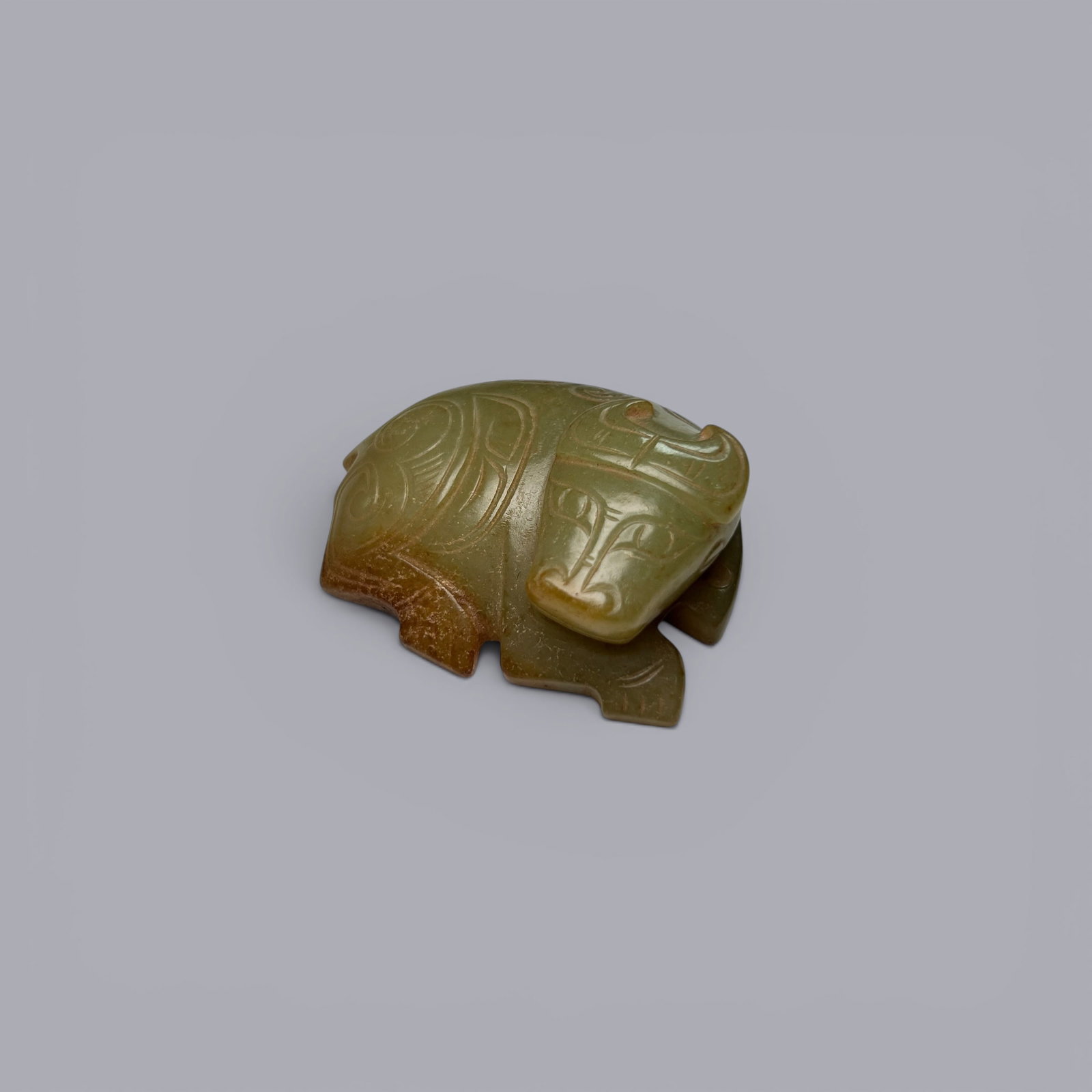 Chinese Art, A Jade Ox, 11th–8th Century BC, Zhou Dynasty: A Jade Ox, 11th–8th Century BC, Zhou Dynasty, Length 4.6 cm, Width 3.7 cm, Height 1.5 cm Condition.