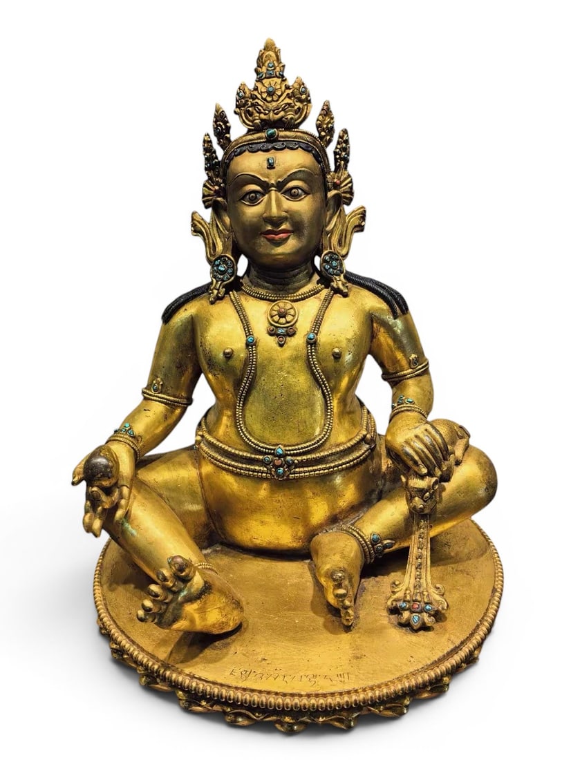Himalayan Art, Tibet, 16th–18th Century, A Gilt Bronze Figure of Yellow Jambhala: Himalayan Art, Tibet, 16th–18th Century, A Gilt Bronze Figure of Yellow Jambhala, Height: 38 cm, Width: 29 cm.