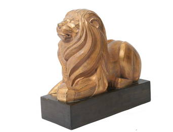 Gilt wood Carved Lion American 20th Century Gilt wood carved statue perched on a wood base. Art Deco