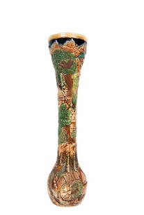 Mettlach Style German Bud Vase: Mettlach style bud vase, German. Approx Site Size: 18"H All lots sold as is. La Belle Epoque Auction House does NOT offer any in-house shipping. We recommend contacting UPS Store