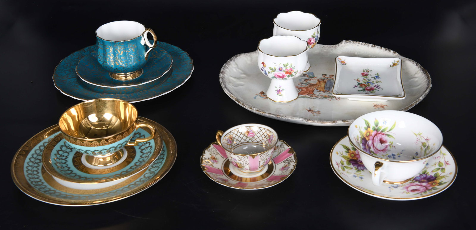 Group of Fine Bone China: Including: Royal Albert Heirloom bone china teacup, saucer and dessert plate. Elizabethan fine bone china by Taylor & Kent England teacup, saucer and dessert plate. Winter,big Bavaria Germany teacup a