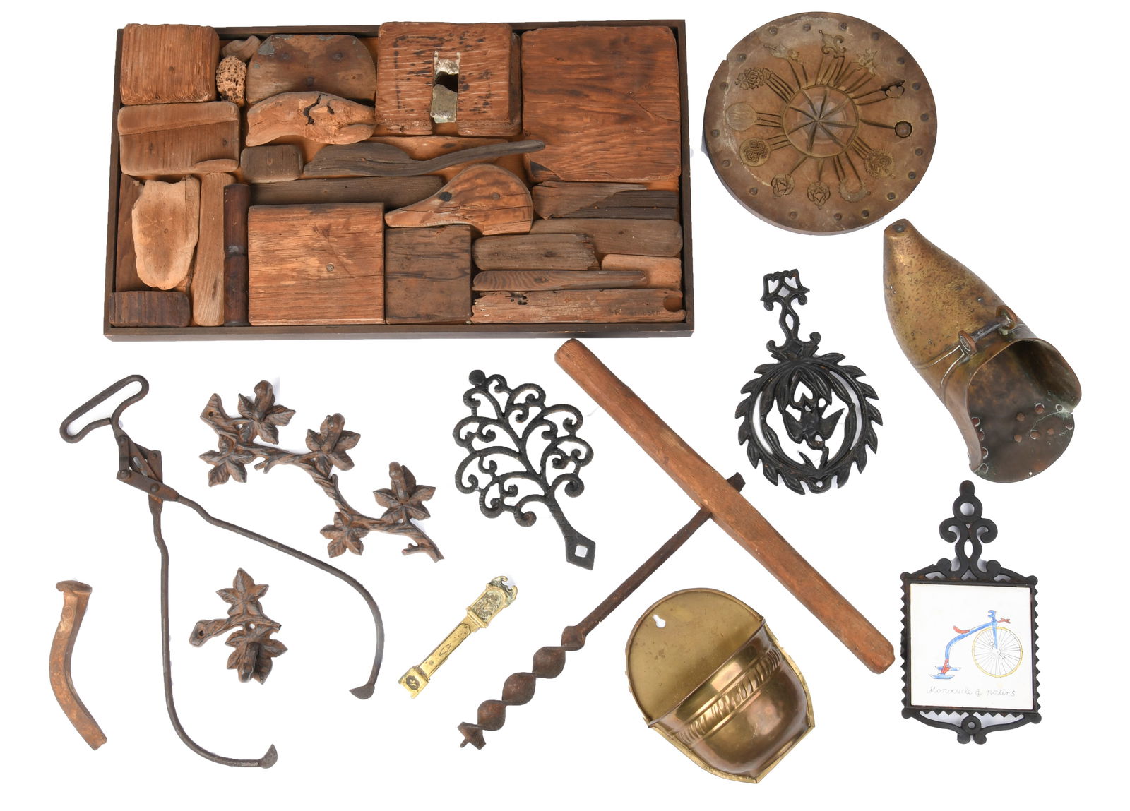 Assorted Group of Antique Tools: Assorted Group of Antique Tools1 x Wooden Wall Art1 x Ice Tongs1 x Brass Wall Pocket Planter1 x Oversized Cork Screw1 x Brass Stirrup Object3 x Trivets1 x Wooden Mold1 x Nail likely railroad
