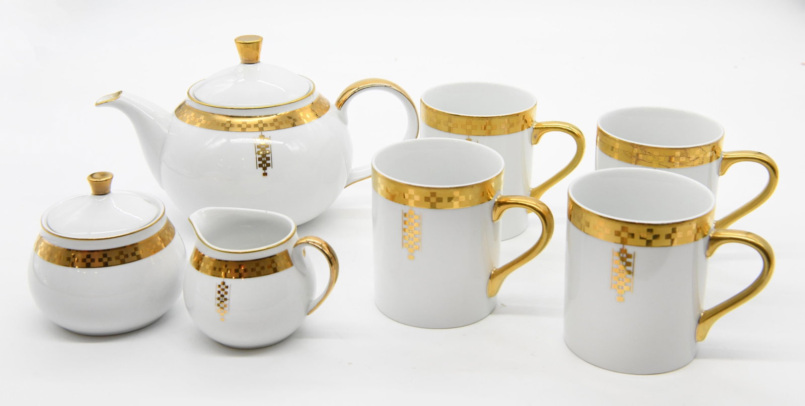 Frank Lloyd Wright Tiffany & Co Imperial China: Frank Lloyd Wright Tiffany & Co Imperial China Four Mugs Approximate Size of Piece: 3.5” H x 4.25” W x 3” D One sugar bowl with lid Approximate Size of Piece: 4” H x 3.5”