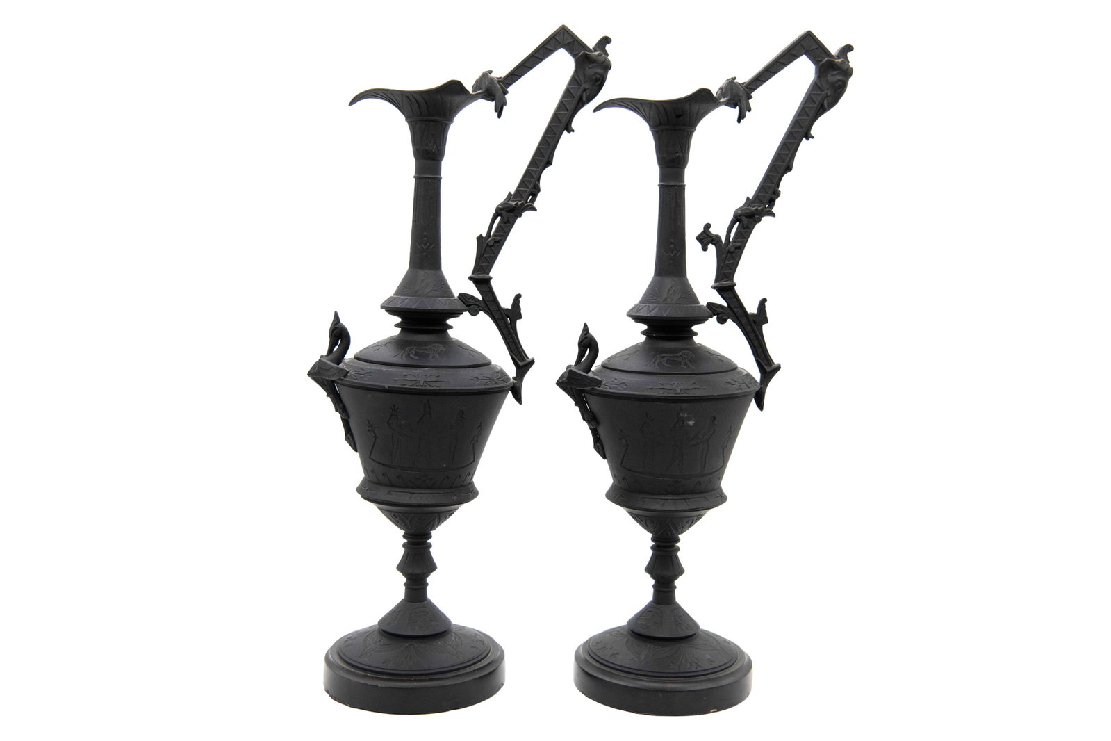 Pair of Antique Black Metal Ewers: Pair of Antique Black Metal Ewers Approximate size each: 18.5” H x 6” W x 5.5” D One vessel is slightly wobbly around the base but stands just fine. Minor chips around the bases.