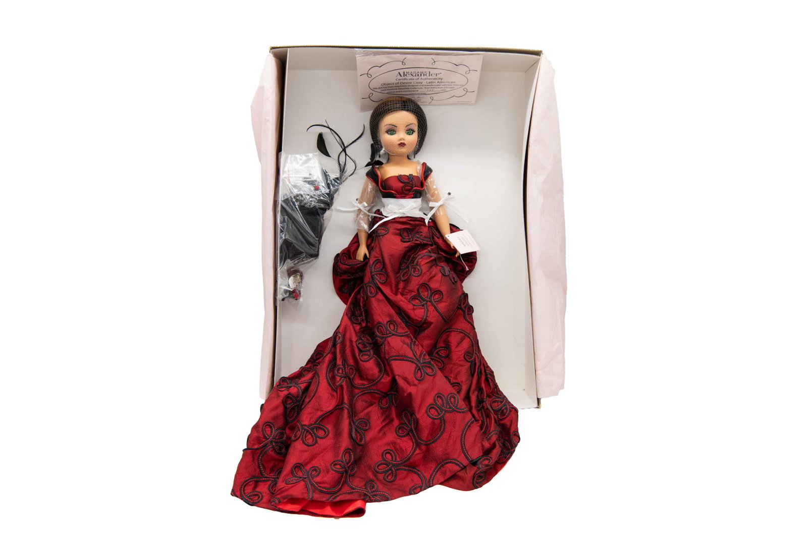 Madame Alexander ‘Object of Desire Cissy - Latin American’ 38331, 2004: Madame Alexander ‘Object of Desire Cissy - Latin American’ 38331, 2004 Includes Certificate of Authenticity. Numbered (check number) Box has denting, scuffing and foxing commensurate with 