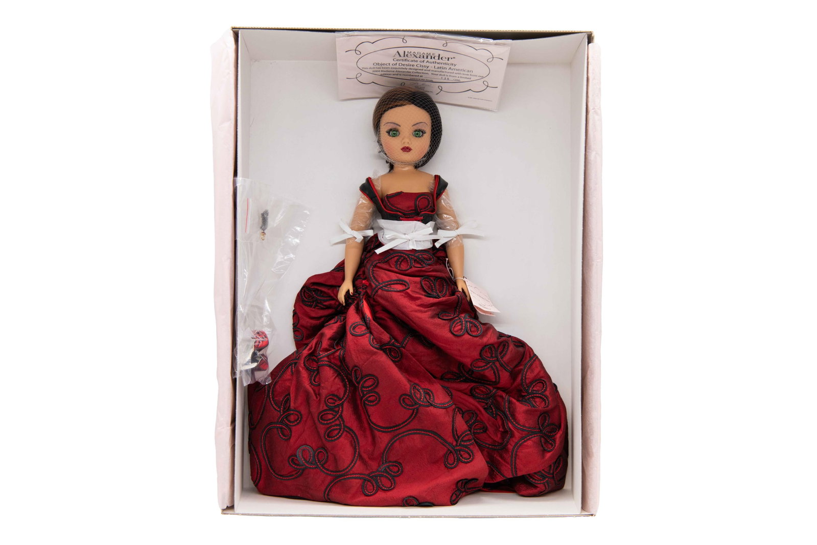 Madame Alexander ‘Object of Desire Cissy - Latin American’ 38331, 2004: Madame Alexander ‘Object of Desire Cissy - Latin American’ 38331, 2004 Includes Certificate of Authenticity. Numbered 135/200. Box has minimal wear with minor creases commensurate with age