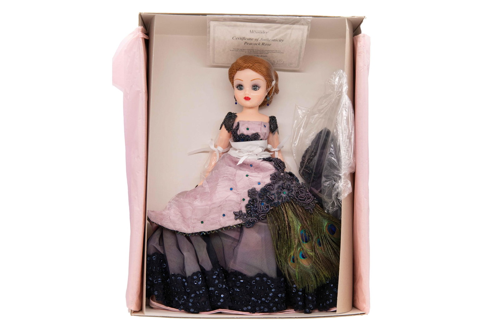 Madame Alexander ‘Peacock Rose’ 28450 Doll, 2000: Madame Alexander ‘Peacock Rose’ 28450 Doll, 2000 Includes Certificate of Authenticity. From a limited edition of 600. Box has minimal wear with minor dents and scuffs commensurate with age