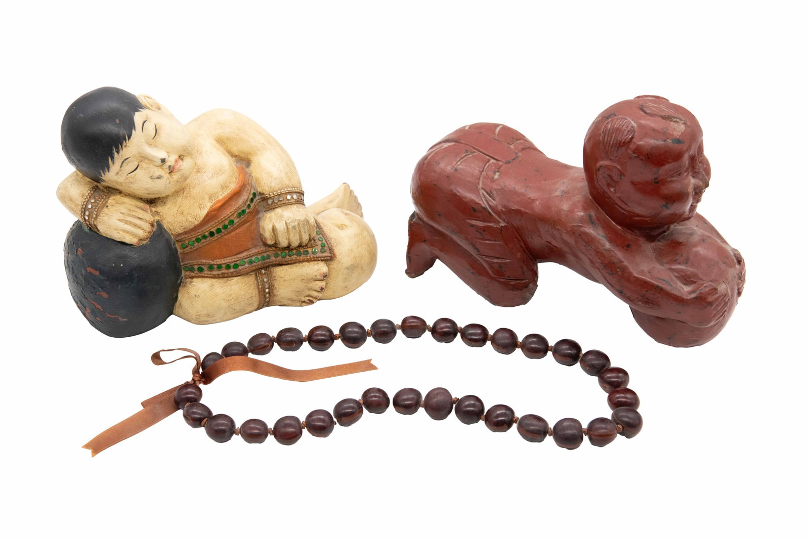 Group of 2: Chinese Porcelain Pillow & Carved Buddha: Group of 2: Chinese Porcelain Pillow & Carved Buddha 1 x Chinese Wood Carved Buddha Approximate size: 7.25” H x 10.5” W x 4.5” D 1 x Buddha Pillow Approximate size: 7.25” H x 1