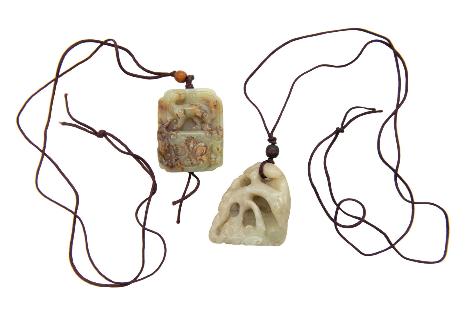 Two Carved Jade Pendant Necklaces: Two Carved Jade Pendant Necklaces Approximate size of larger piece: 2” H x 2” W Approximate size of smaller piece: 2” H x 1.5” W