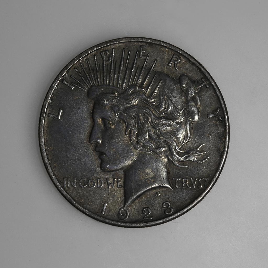 1923 D Peace Silver Dollar: Coin Type: Peace Silver Dollar Year: 1923 Mint: Denver Mintage: 6,811,000 Metal Content: .900 Silver, .100 Copper Weight: Approx. 26.73 grams Diameter: Approx. 38.1 mm Designer: Anthony de Francisci
