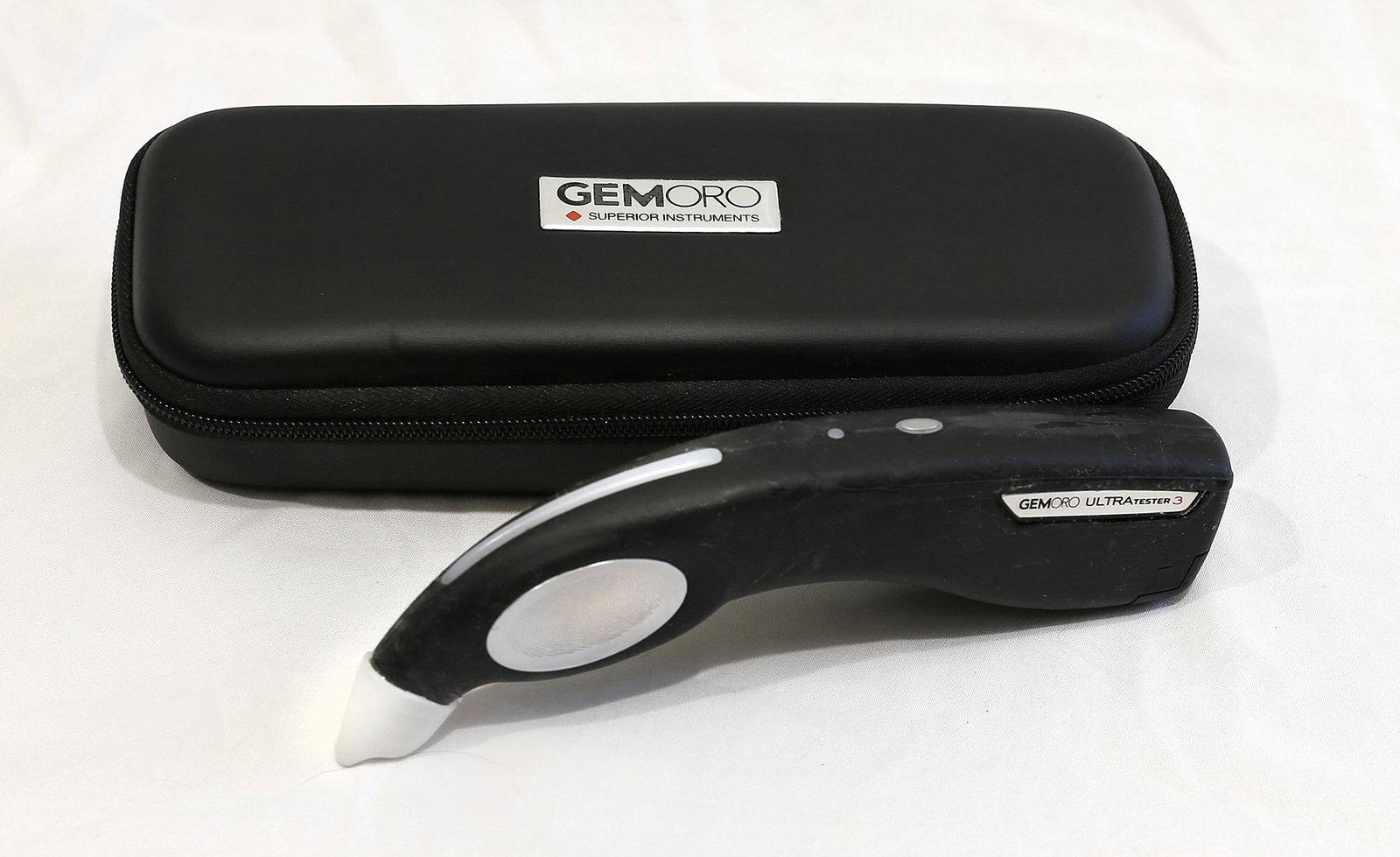 GemOro Ultra Tester 3 Moissanite Tester: Items: 1) GemOro Ultra Tester 3 Moissanite Tester Condition: Very Good Note: Is easily able to be calibrated, Has stone testing plate, has power cord, has manual, equipment powered up upon inspection 