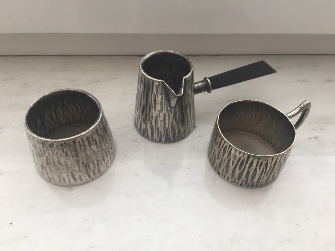 Austrian Hoffman Style Coffee Set: Hand Hammered miniature coffee set with ebony handles, in the style of Joseph Hoffmann, Wiena Werkstate.