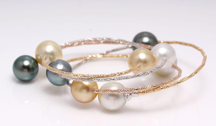 18 kt. Tricolour Gold - 10x11mm Tahitian and South Sea: This bracelet measures 55cm in total and wraps beautifully several times around the wrist.The bracelet contains 9 top quality high lustered South Sea and Tahitian Pearls, 10x11mm each in measurement.T