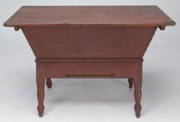 PENNSYLVANIA RED-PAINTED PINE DOUGH BOX ON LEGS,: PENNSYLVANIA RED-PAINTED PINE DOUGH BOX ON LEGS, rectangular two-board top with applied cleats above a dovetailed box raised on flaring turned legs. Old dry surface.. Second quarter 19th century. 27"