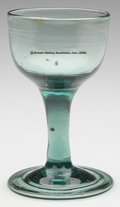 FREE-BLOWN WINE GLASS, light green lead glass wit
