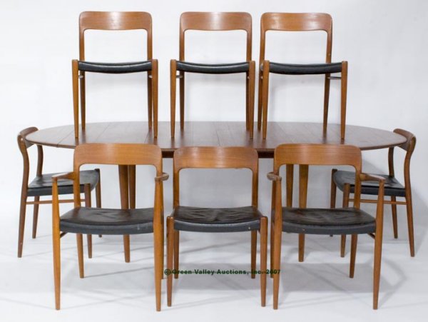 J. L. MOLLER SCANDINAVIAN TEAK DINING TABLE AND E: J. L. MOLLER SCANDINAVIAN TEAK DINING TABLE AND EIGHT CHAIRS, consisting of an oval extension table raised on four tapered round legs with two 16 3/4" wide extension boards, along with two arm and six