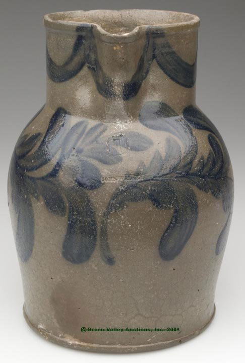 VERY RARE STAMPED "JOHN WALKER", WASHINGTON, D.C. D: VERY RARE STAMPED "JOHN WALKER", WASHINGTON, D.C. DECORATED SALT-GLAZED STONEWARE PITCHER, "1" gallon capacity stamp, brushed cobalt swags below rim and two sweeping flowers around shoulder, additiona