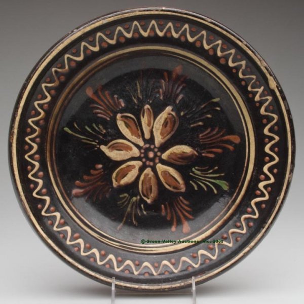 SLIP-DECORATED LEAD-GLAZED EARTHENWARE DISH, buff c
