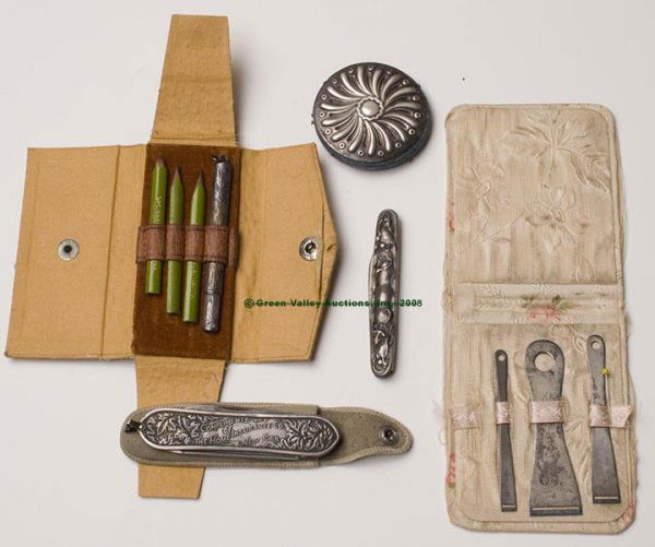 STERLING SEWING ARTICLES, LOT OF FIVE, consisting: STERLING SEWING ARTICLES, LOT OF FIVE, consisting of two knives, a pincushion, a three piece bodkin set fitted in a cloth case, and a four piece writing set fitted in a case. Late 19th/early 20th cent