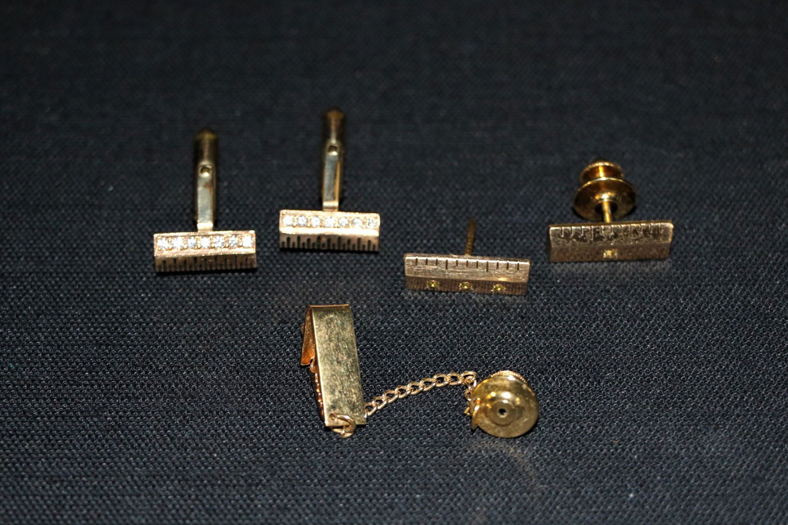 Collection of Gold Cufflings and Tie Clip (1 of 3)