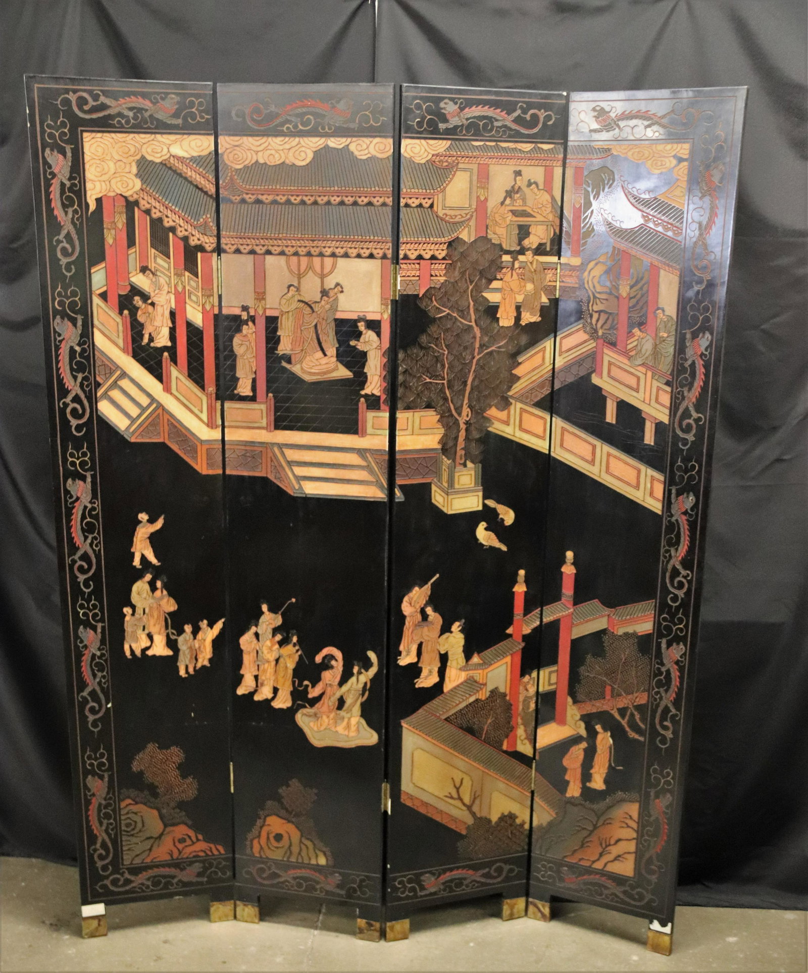 Asian Motif Wood Screen: Decorative wood carved and painted screen featuring brass feet; Sticker on feet reads "Made in Hong Kong, China"; Fully extended measures approximately H 84.5 x W 64 x D 1 inches; Significant damage t