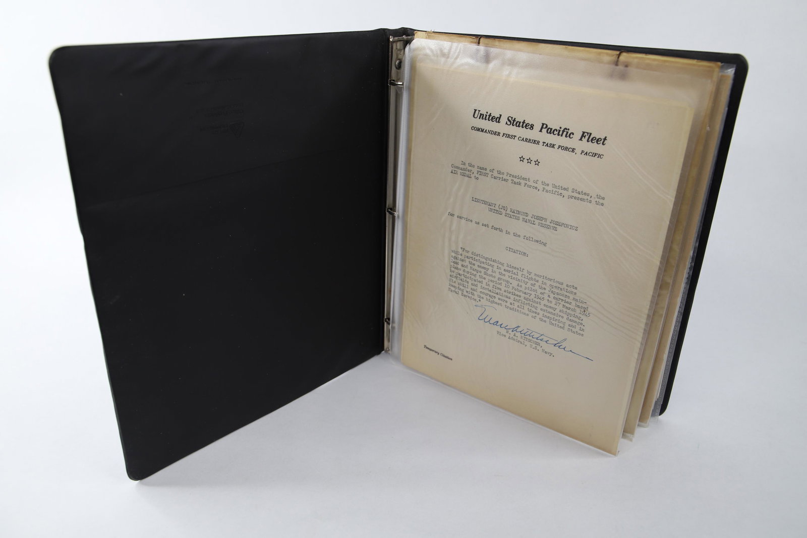 Binder of WWII Memorabilia: Binder includes seventeen pages of WWII era military letters, newspapers, photographs, Sketches and miscellaneous memorabilia; Includes military letter signed by John S. McCain Jr.; Measures approxima