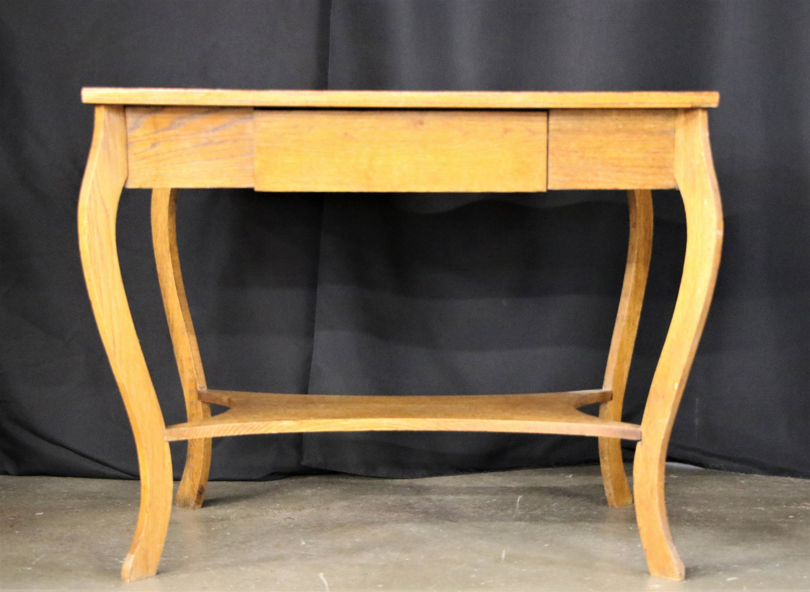 Wood Hallway Table: Unmarked wooden table with drawer; Meaures approximately H 24 x W 36 x D 24 inches; Scratching and chipping along edges and some nicks on table surface. See photos