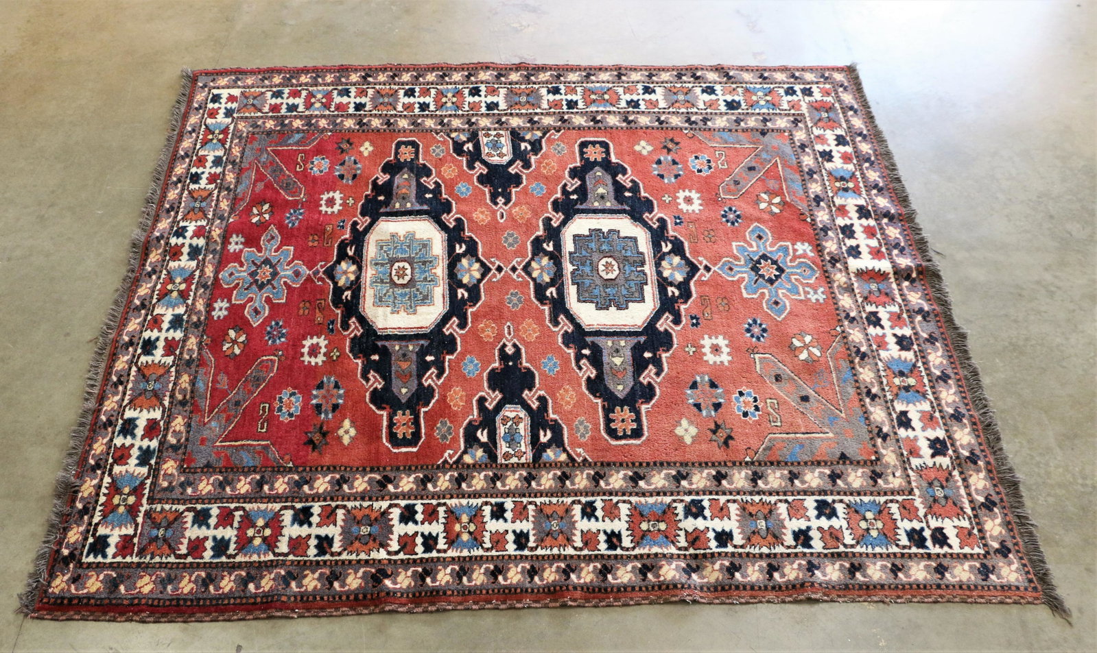 Wool Area Rug: Wool area rug measures approximately H 84 1/2 (fringe to fringe) x W 73 inches; Some fading in color. See photos