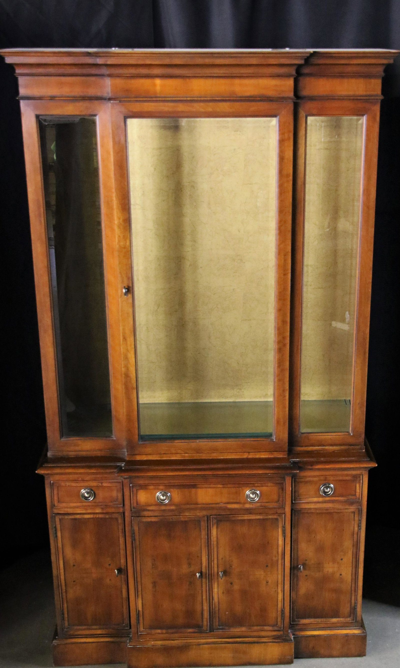 Hekman, China Cabinet: Wooden china cabinet with lighting by Hekman Furniture Company features glass front cabinet on top and brass hardware; Top middle drawer features silverware tray; Measures approximately H 82 x W 44 x 