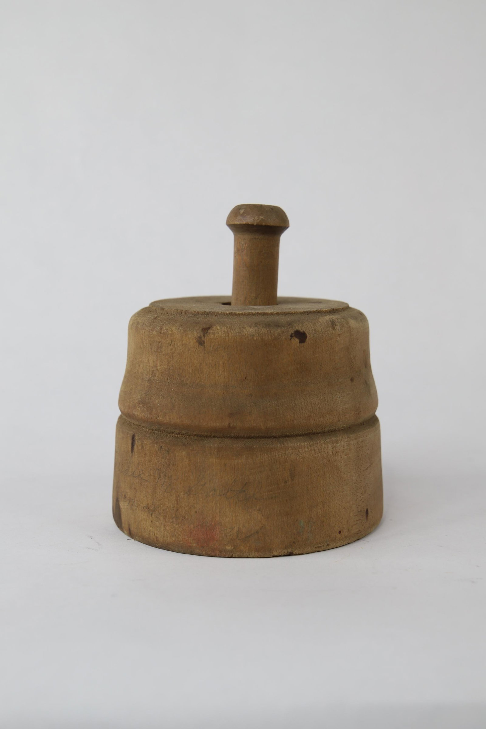Wooden Butter Press: Unmarked wooden butter press with wheat design stamp; Handwritten marking on front reads "Birdie Mcgarth"; Measures approximately H 5 1/2 x W 4 1/2 inches; Some spotting and discoloration on wood. See