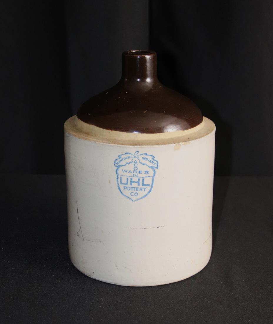 UHL Pottery Co, Whiskey Crock: Vintage one gallon crock; Marked "Acorn Wares UHL Pottery Co"; Measures approximately H 11 x Diameter 7 1/4 inches; Does not have the cork; Chips on rim and scratches. See photos