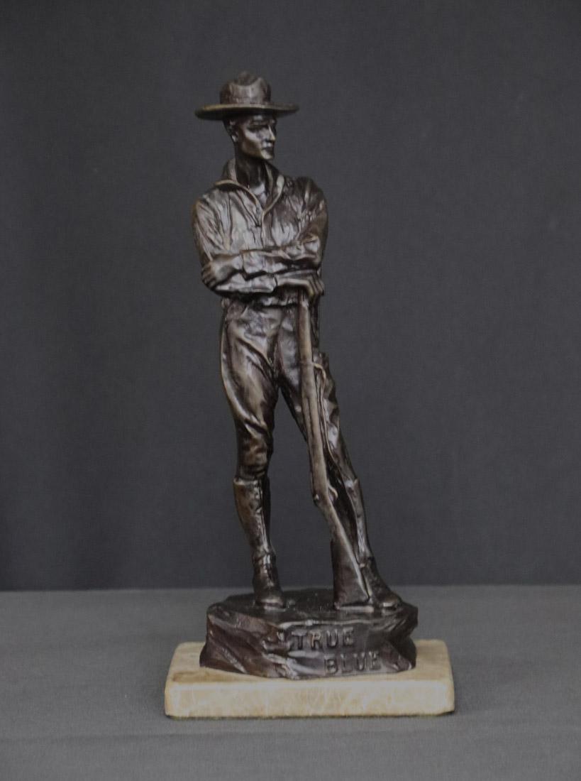 Carl Kauba, Antique Bronze Sculpture: Carl Kauba antique bronze figure of a WWI soldier with rifle, bayonet, ammo belt and pack; Figure stands tall on a rock plinth wearing wide brim hat; Signed on base "C Kauba" and inscribed "National S