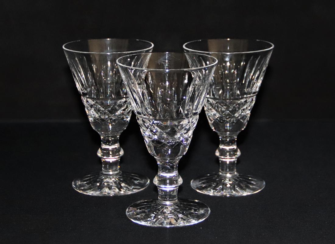 Waterford Crystal Glasses: Three wine glasses; Cut crystal; Waterford makers mark on base; Measures approximately H 5 1/4 x 3 1/4 diameter; No visible damage. See photos