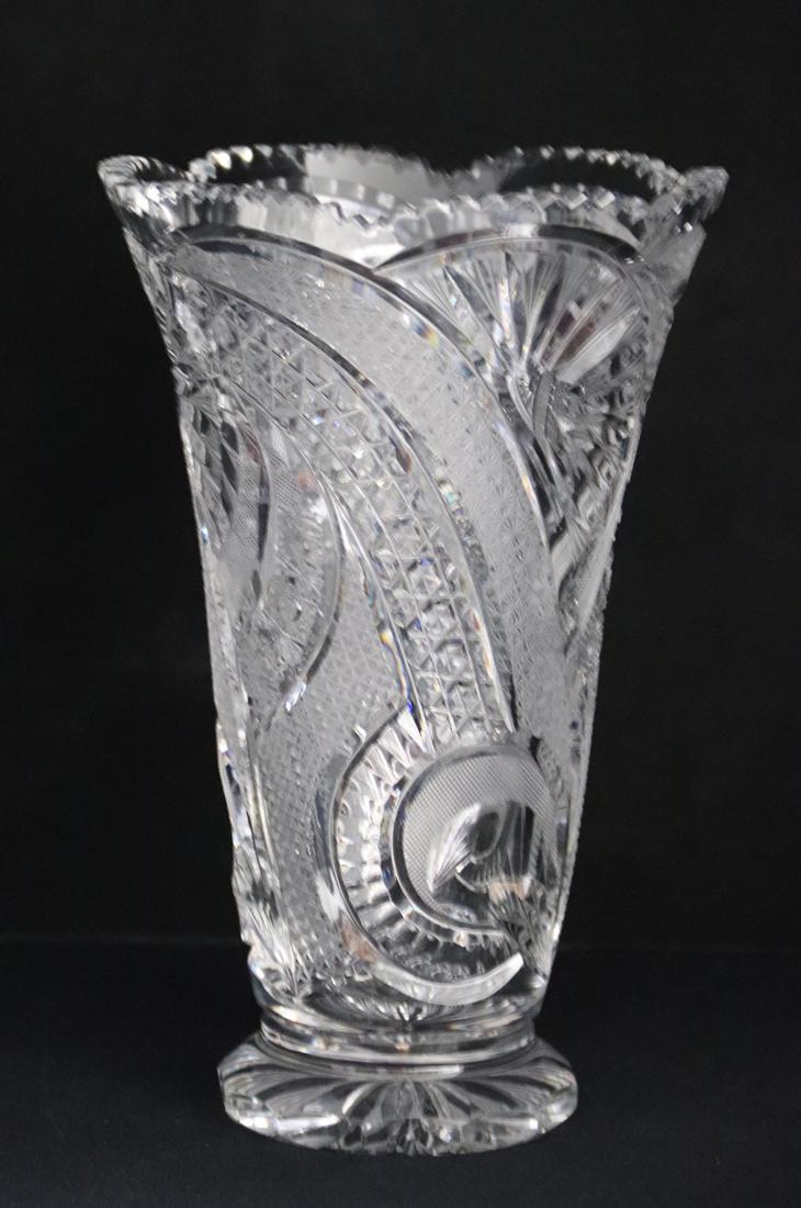 Eastern European Brilliant Glass Cut Vase: Vase with saw tooth edge; Measures approximately H 10 x 6 1/2 diameter inches across the top; No visible makers mark; Bubble in the foot. See photos
