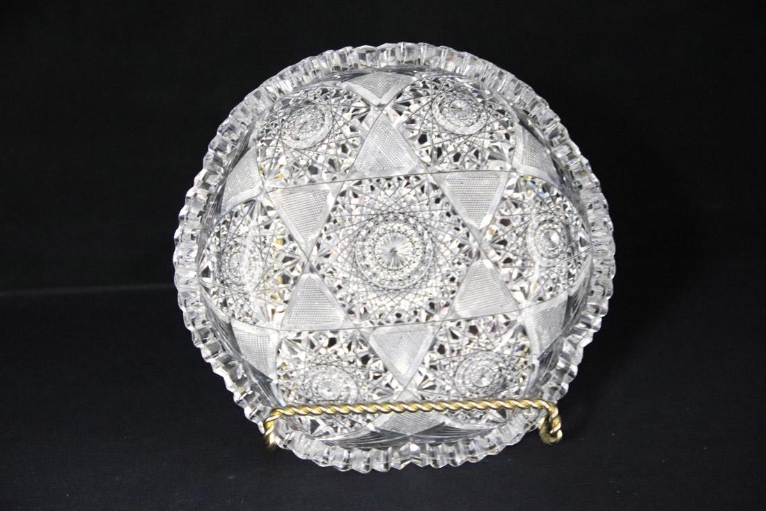 American Brilliant Cut Glass Bowl: Shallow serving bowl with saw tooth edge; Measures approximately H 2 x 8 diameter inches; No visible makers mark; Several chips on three edges that will not show in photographs; One is broken. See pho